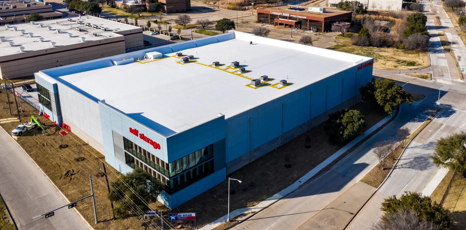 Aerial view of the completed CubeSmart Self Storage Dallas facility, a three-story climate-controlled self-storage building constructed by Synergy Commercial Construction in Dallas, Texas.